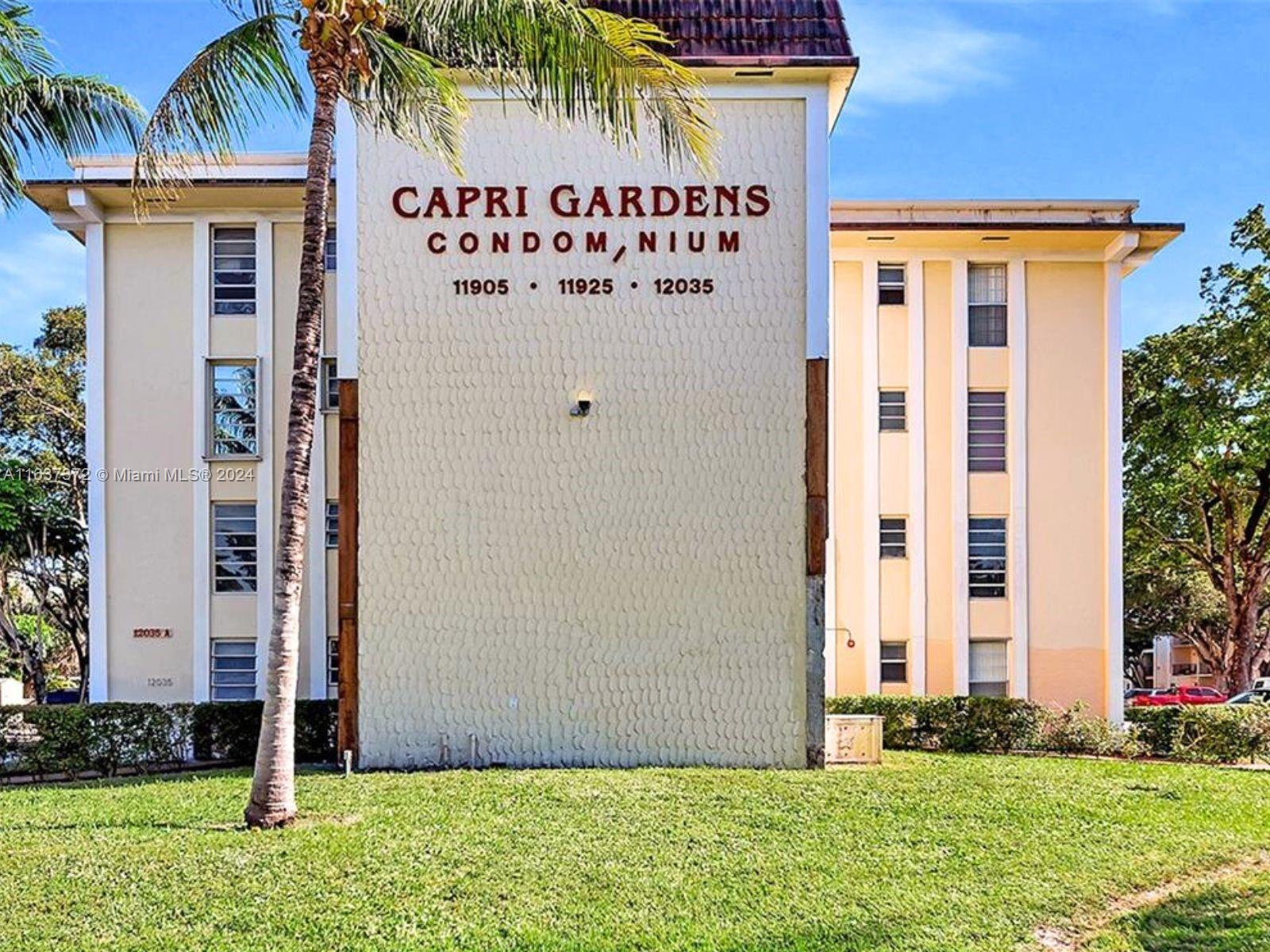 a front view of building with yard