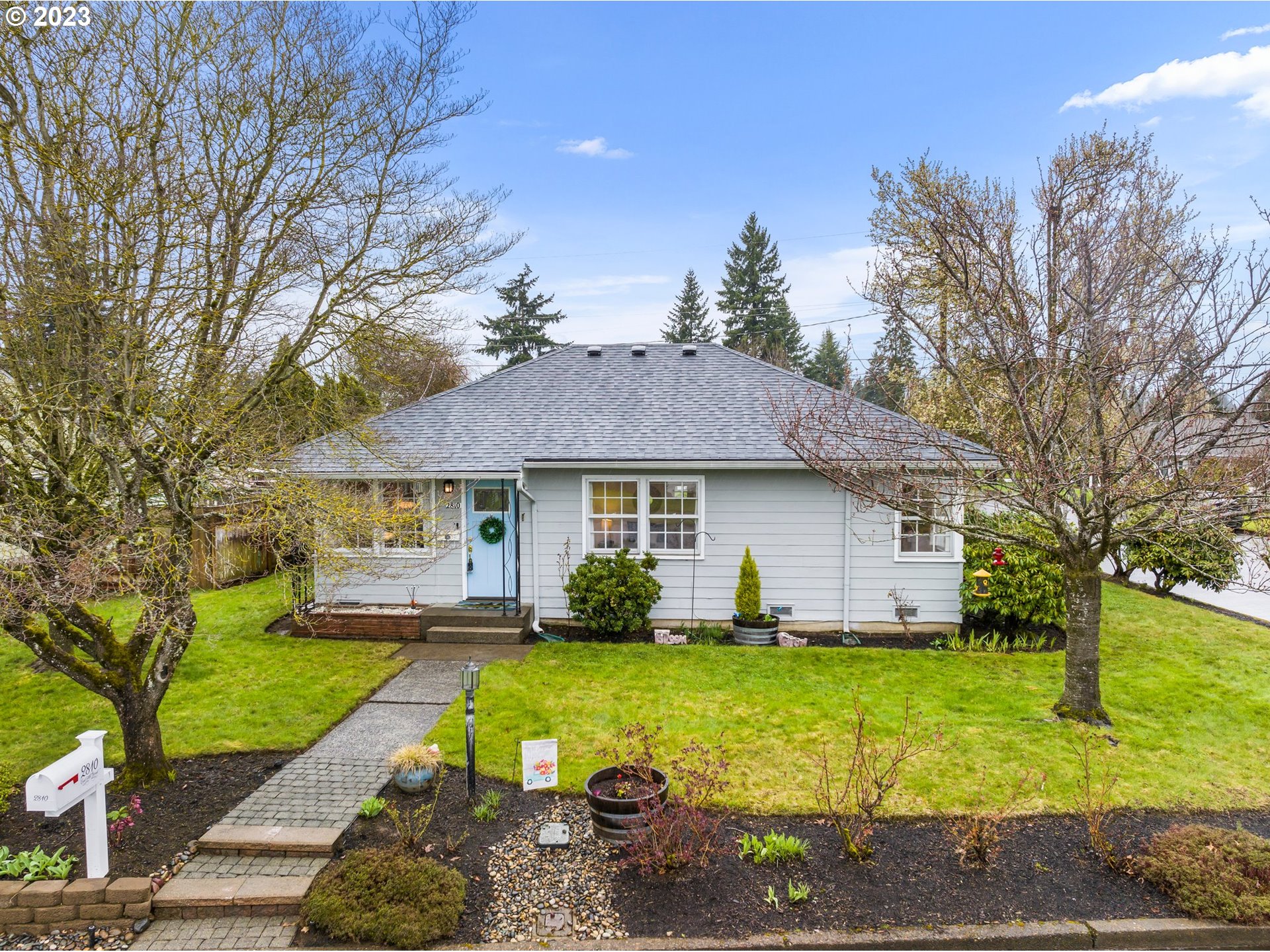 a front view of a house with garden