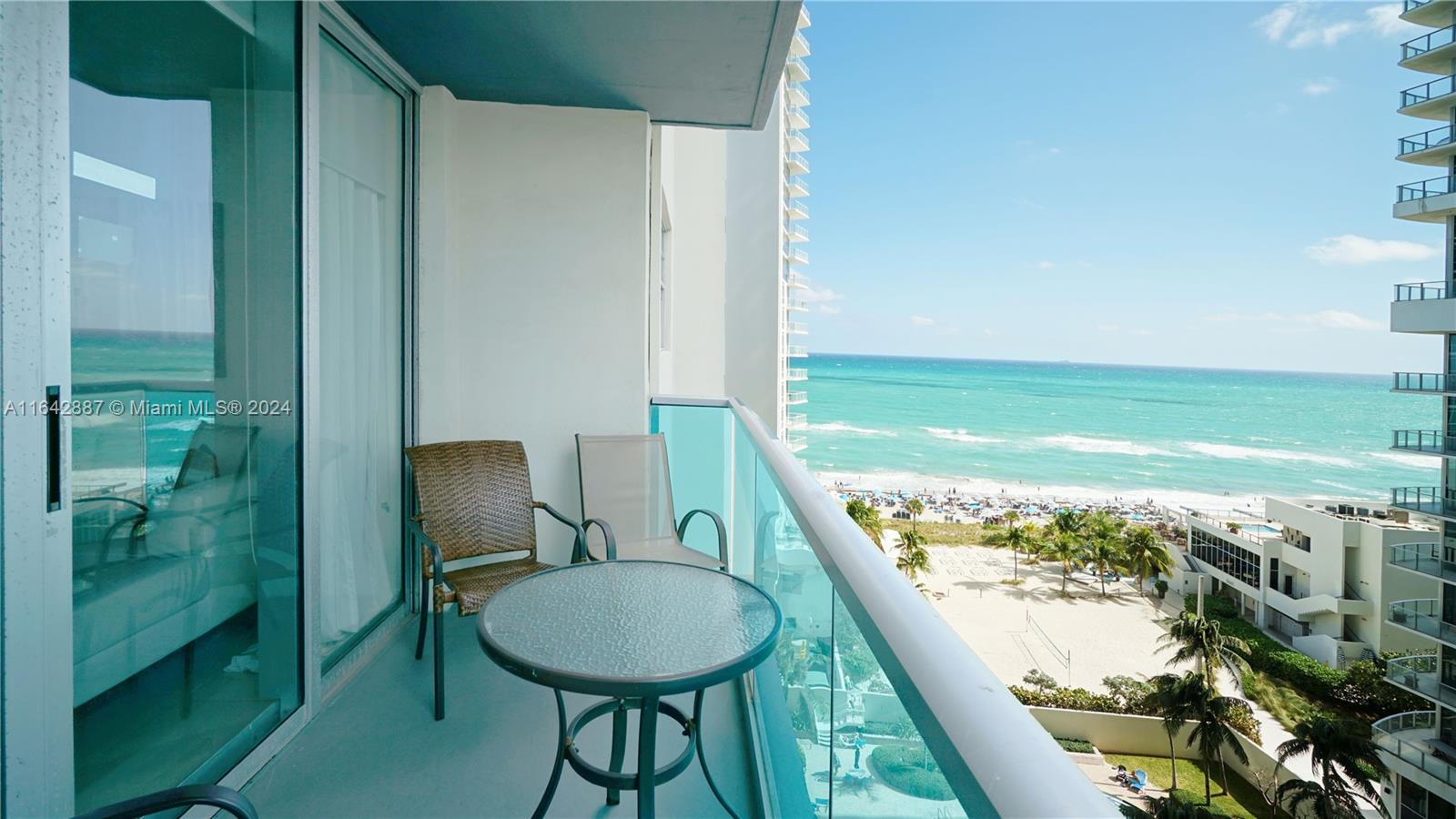 a view of a balcony with chair and table & chairs