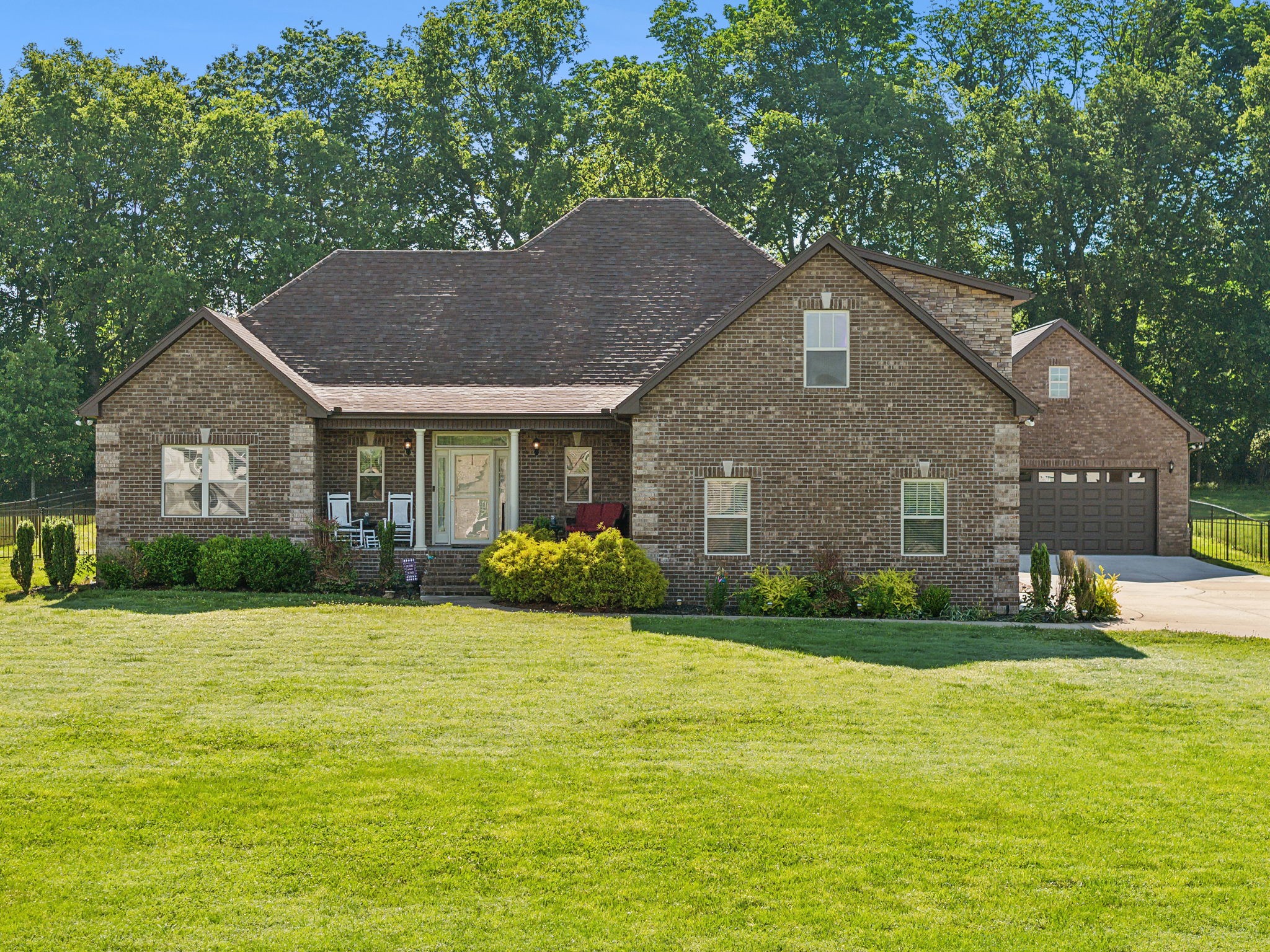 a front view of a house with garden