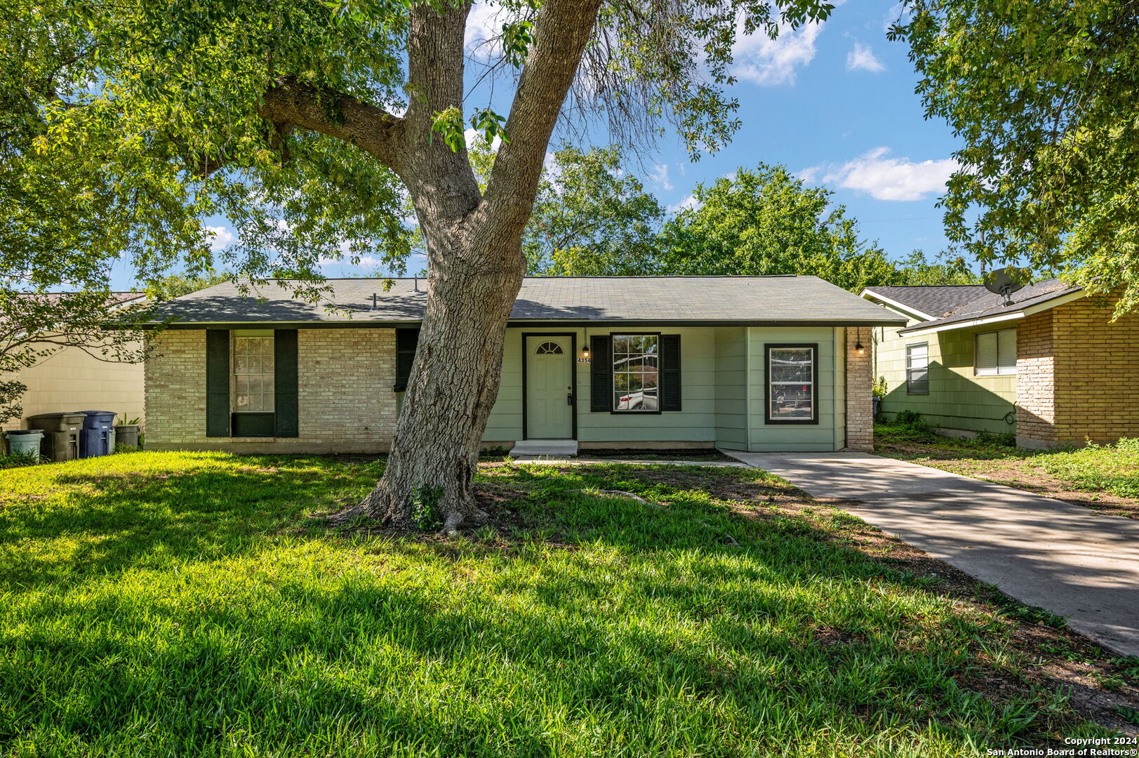 front view of a house with a yard