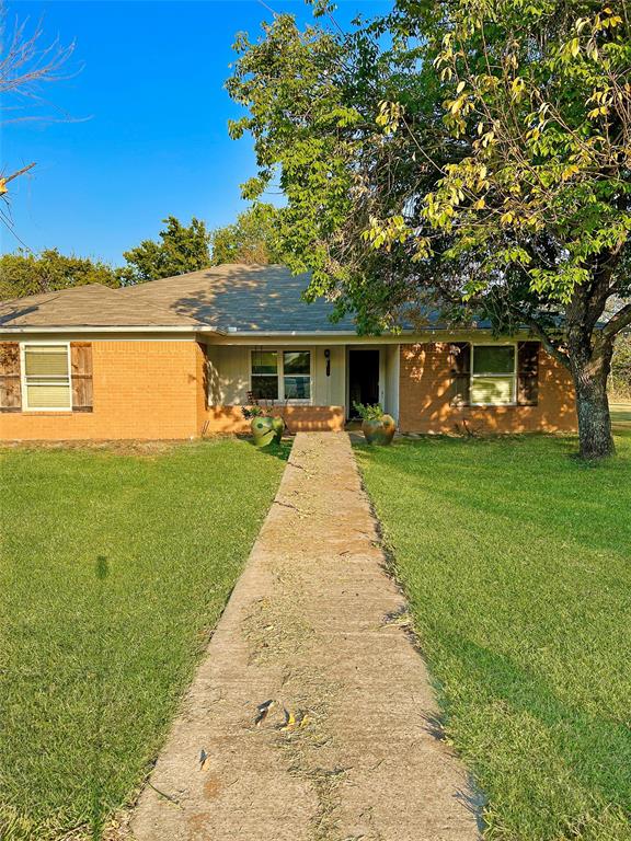 a view of house with yard