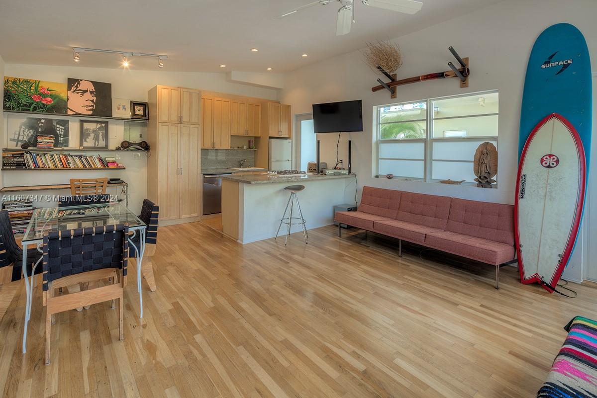 a kitchen with a sink appliances and cabinets