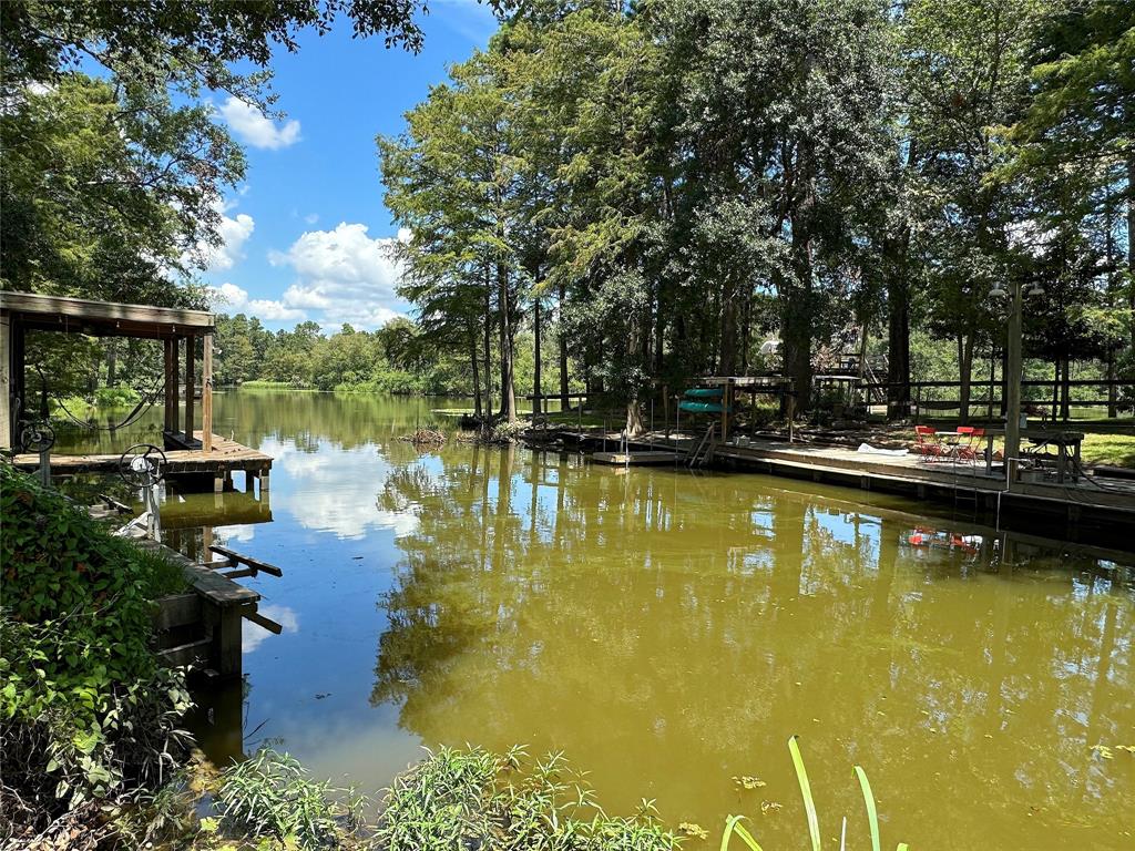 a swimming pool with outdoor seating and yard