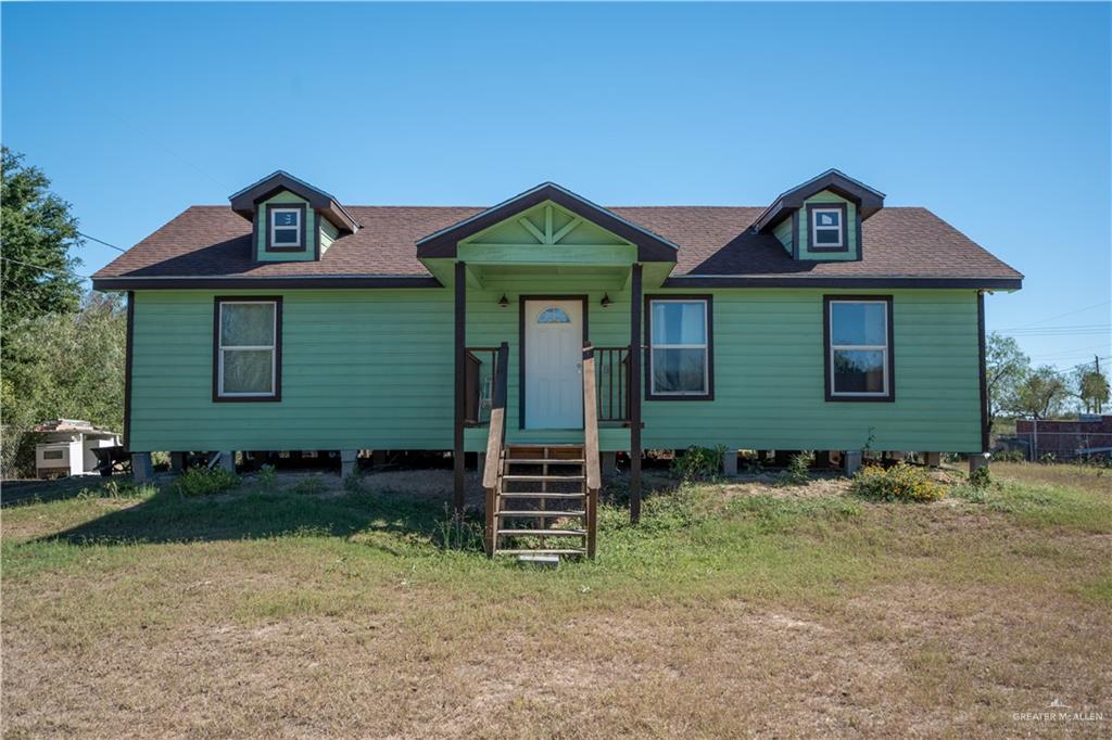 View of front of house with a front lawn