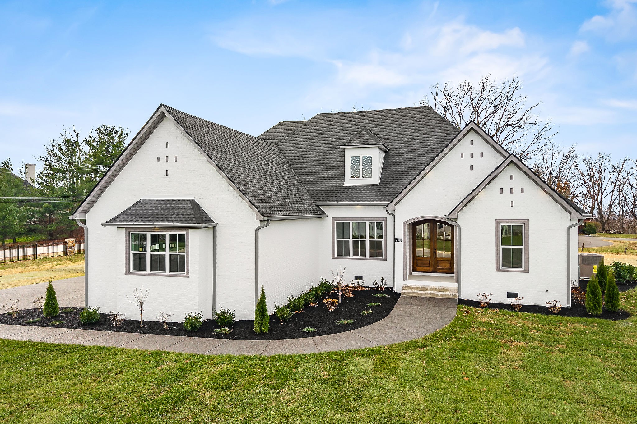 a front view of a house with a yard