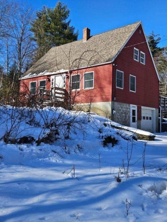 a aerial view of a house with a yard