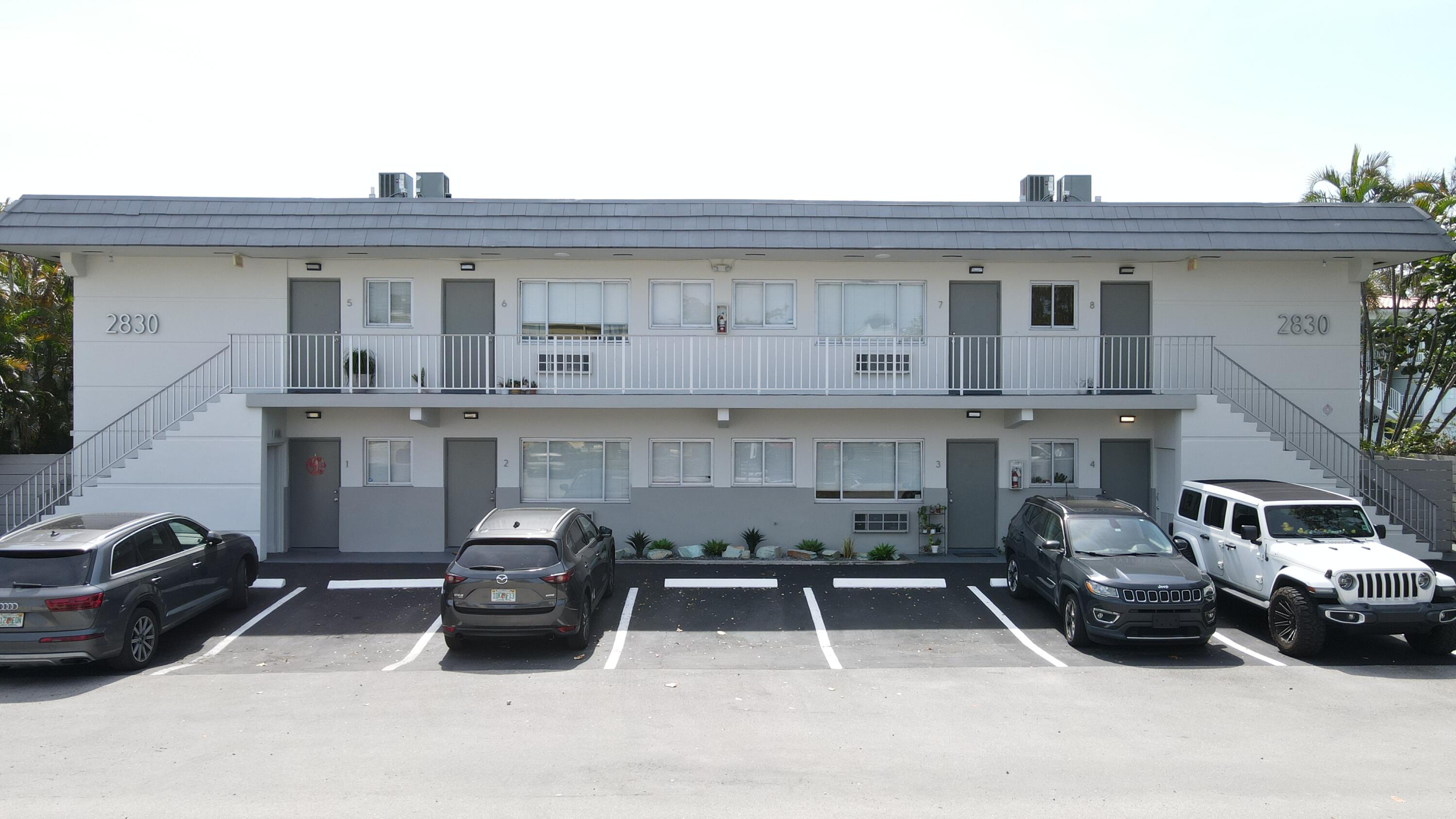 a view of a car parked in front of a building