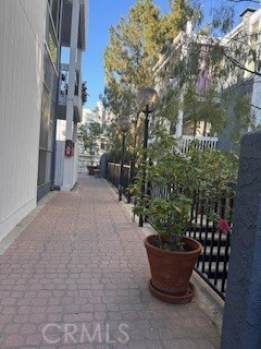 a view of a patio with couches and potted plants