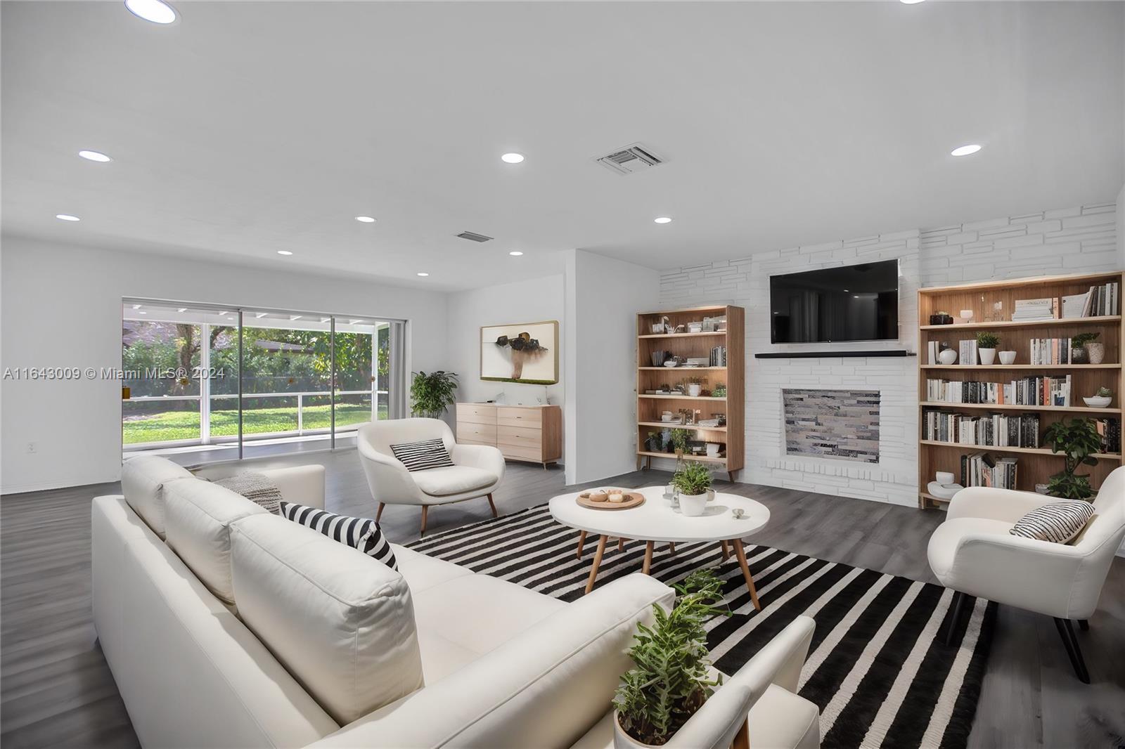 a living room with furniture fireplace and a flat screen tv