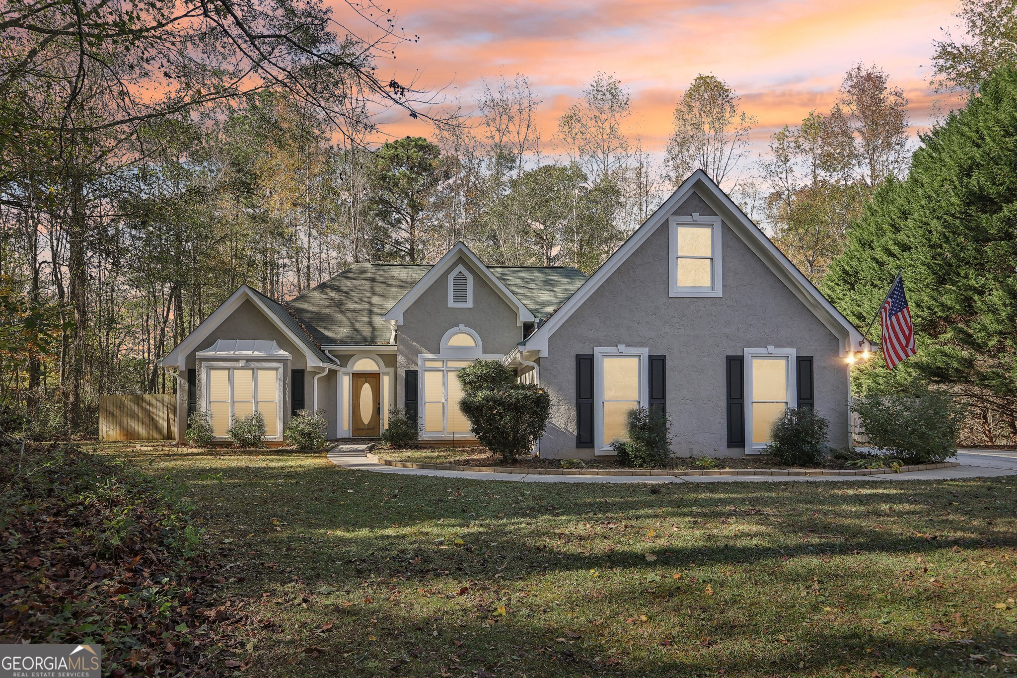 a front view of a house with a yard