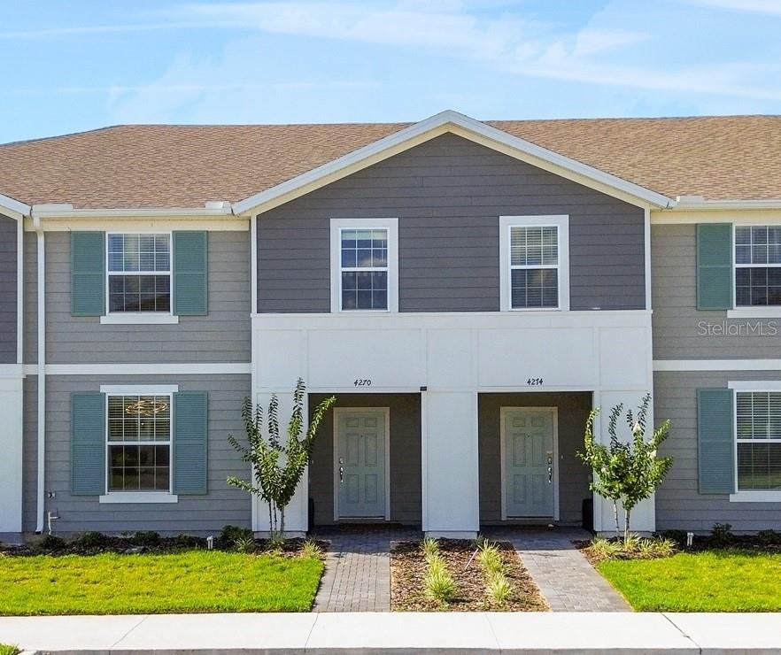 a front view of house with a yard