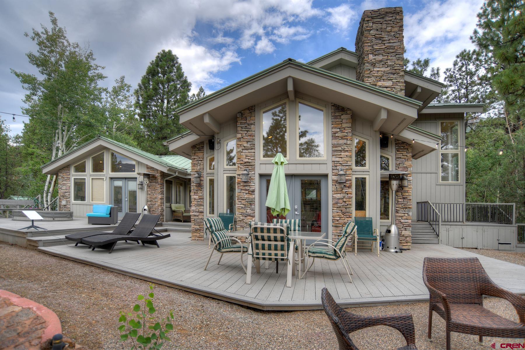 a front view of a house with sitting area