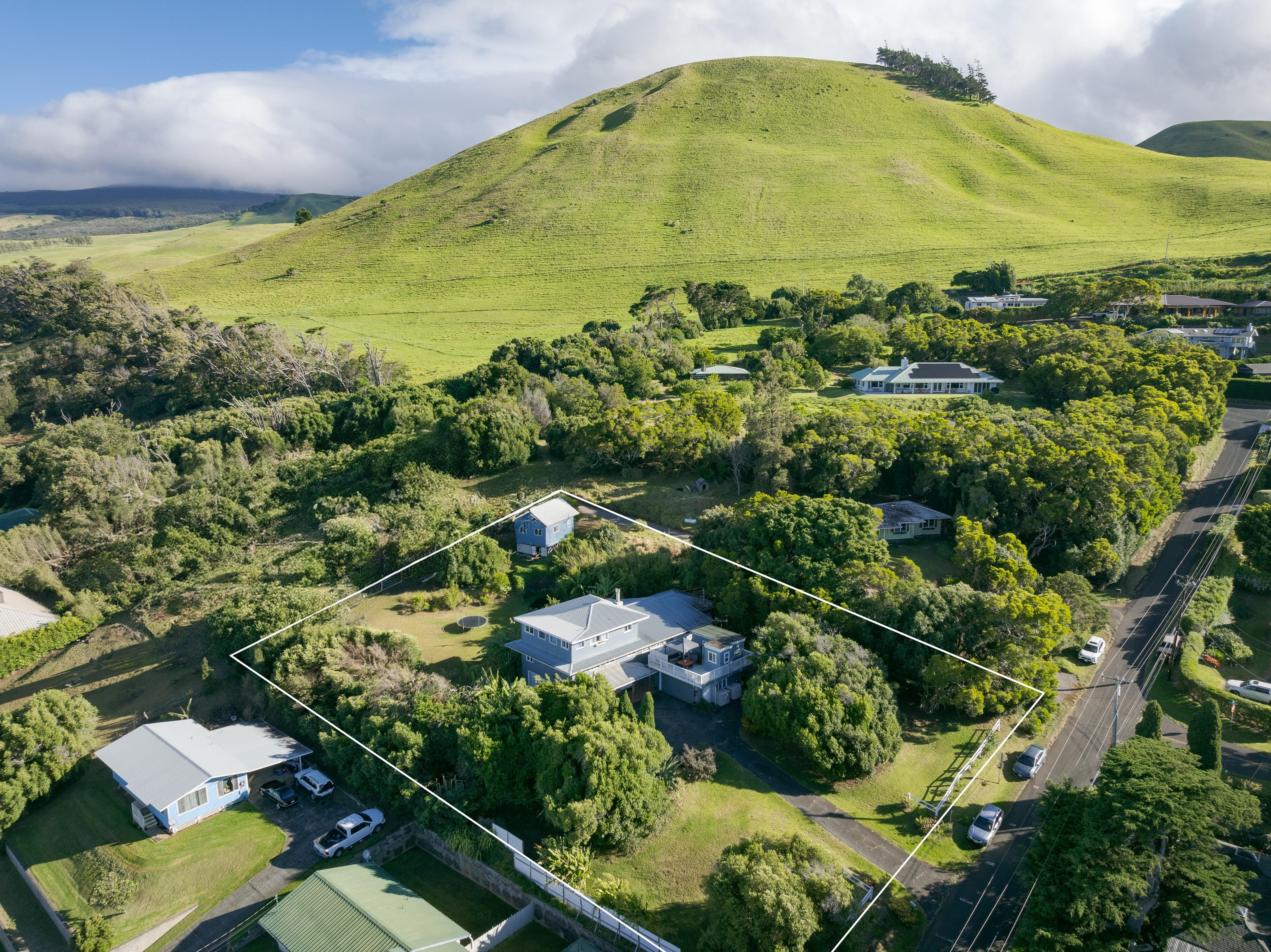 This three-story 3,636 sqft home is configured as 4 bed, 3.5 bath main home with an additional lanai/storage studio with private entrance, one exterior detached storage/studio bringing the total area to 4,011 sqft. *Back lot has been photoshopped.