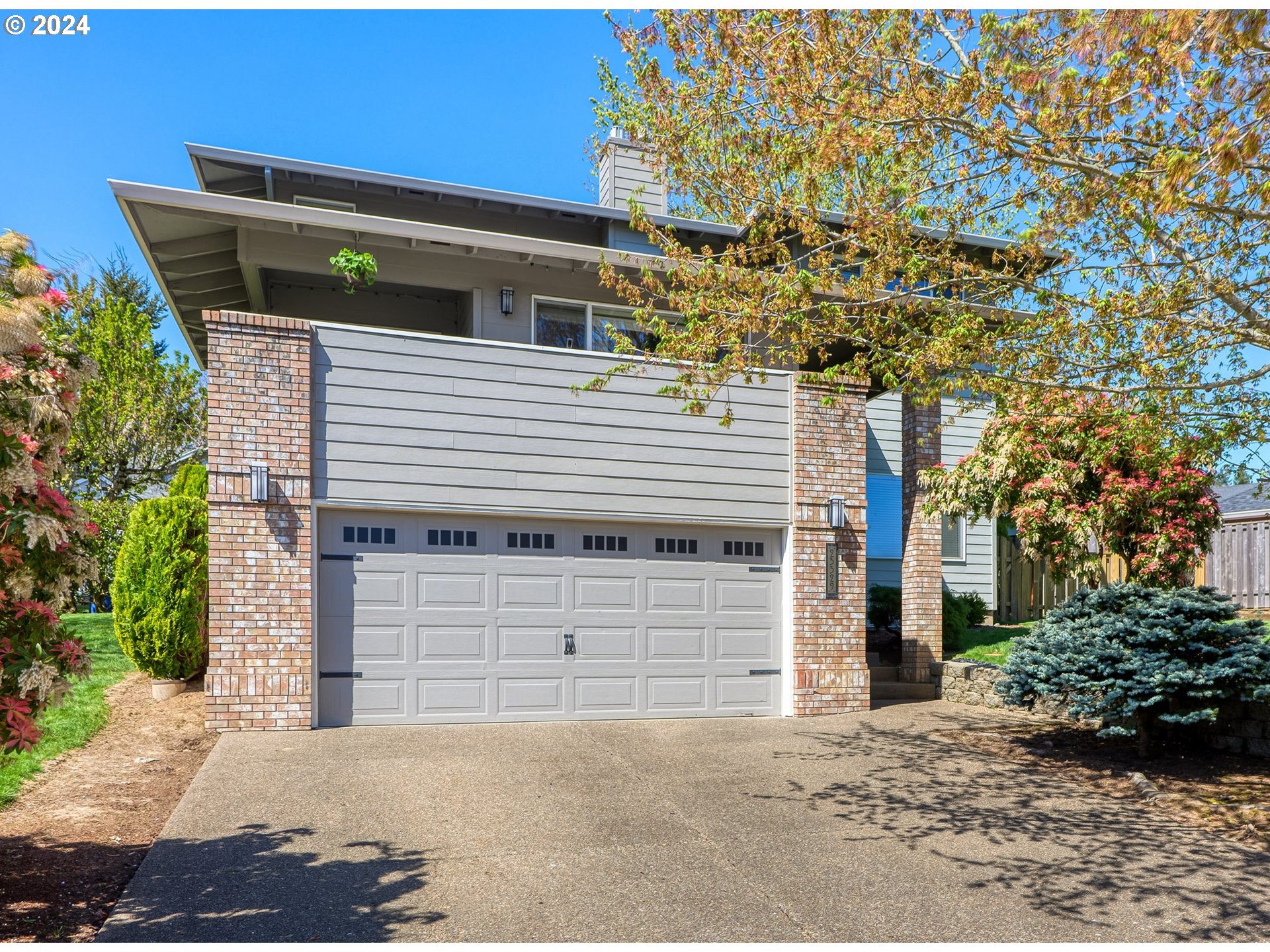 a front view of a house with a garage