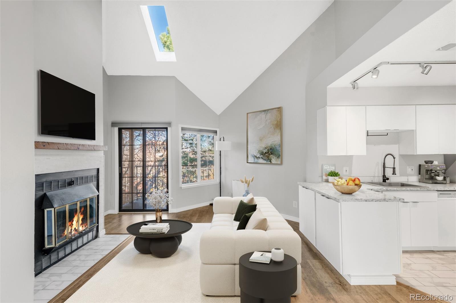 a living room with furniture fireplace and flat screen tv