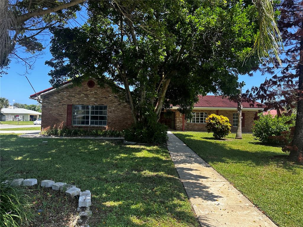 a front view of a house with a yard