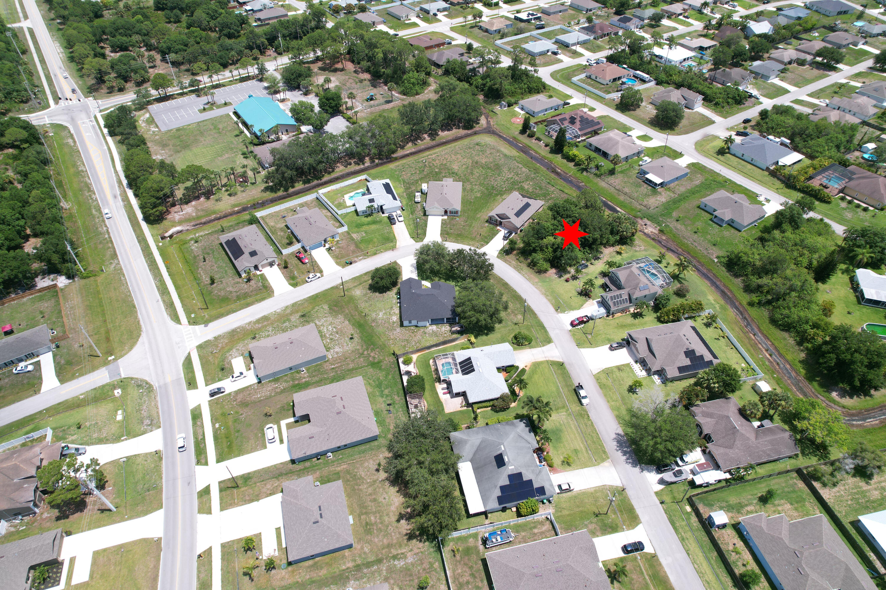 an aerial view of residential houses with outdoor space