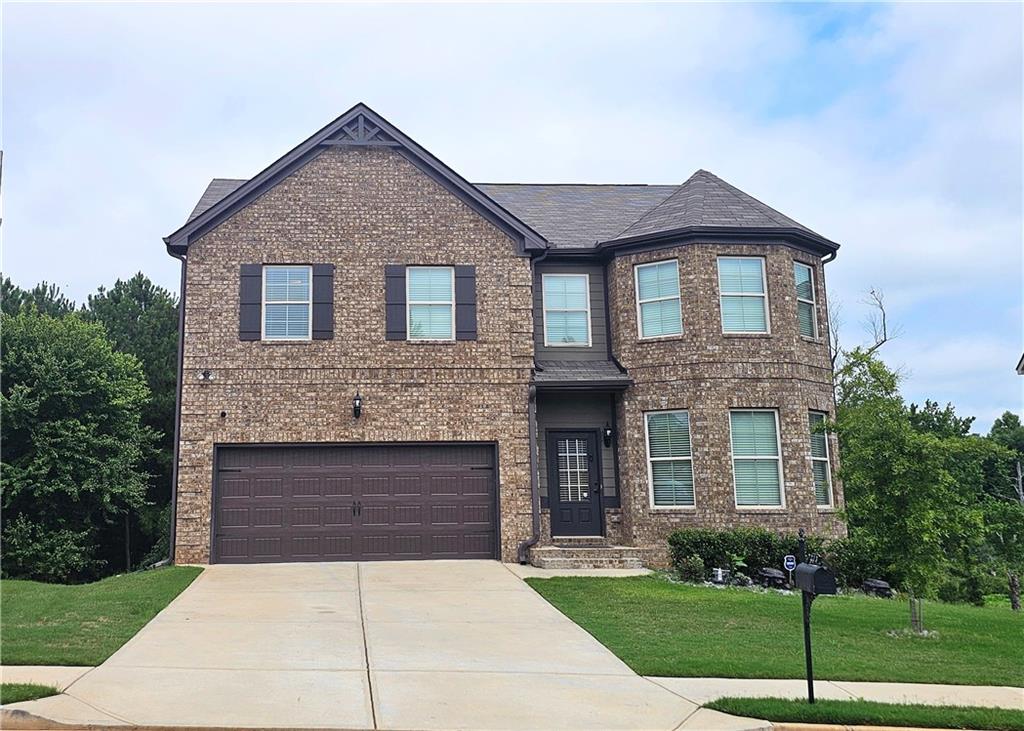 a front view of a house with yard