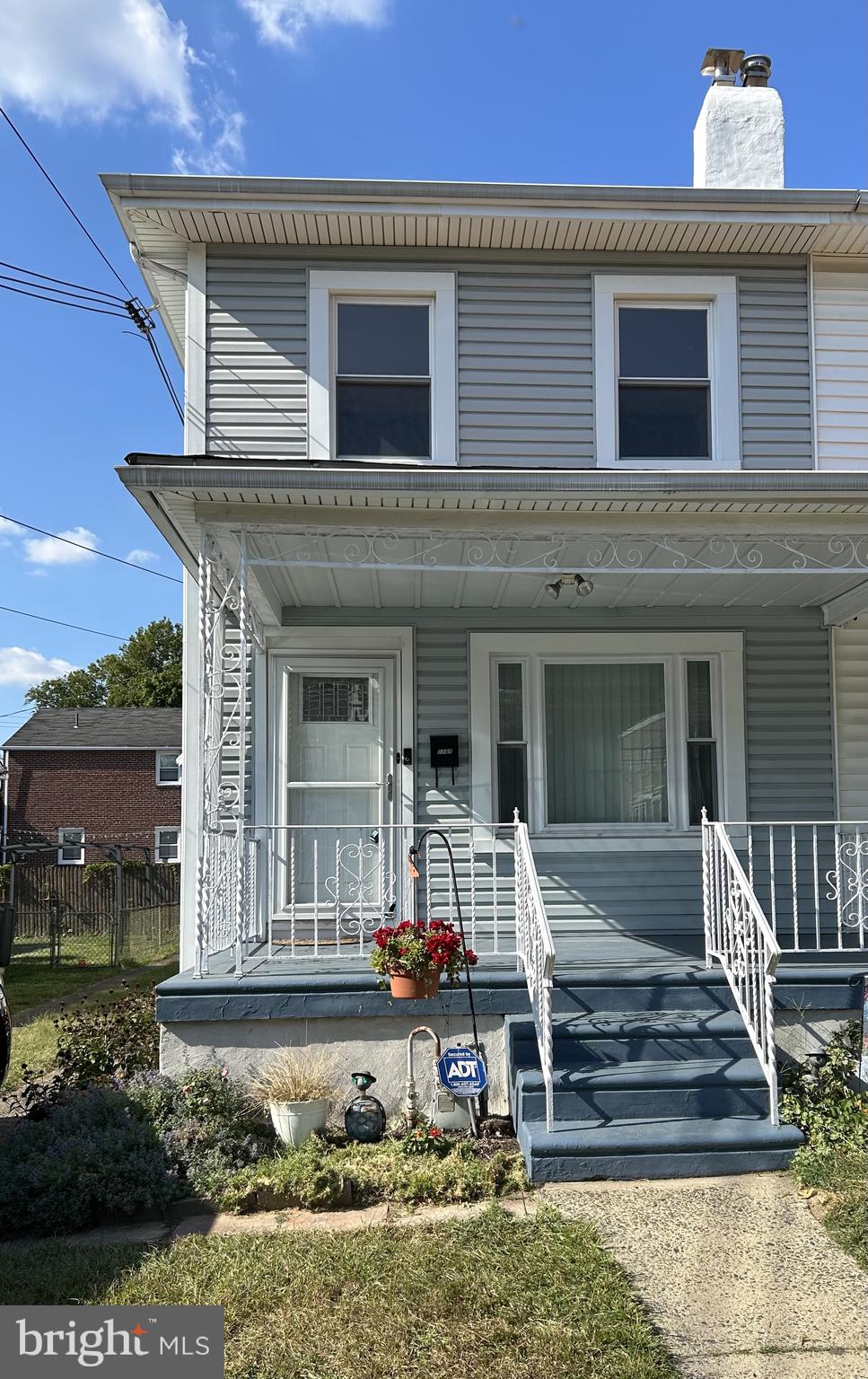 front view of a house with a small yard