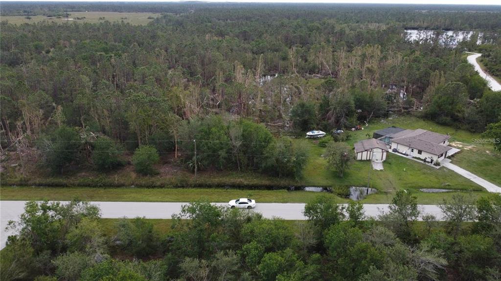 an aerial view of residential house with outdoor space