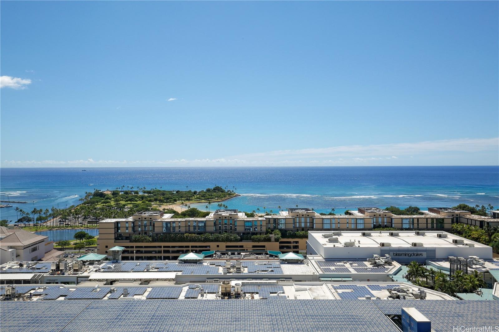 an aerial view of a building with city view