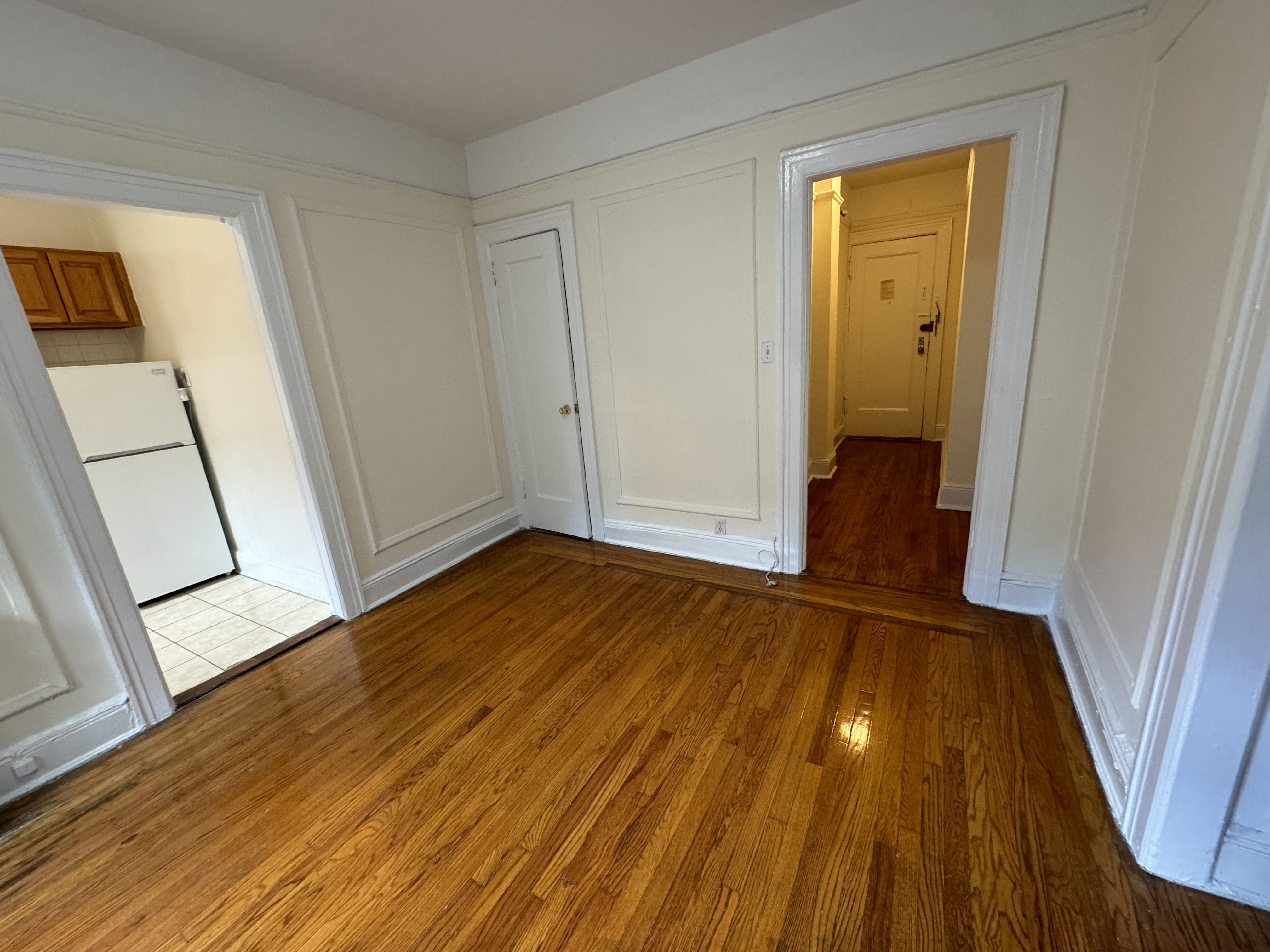 a view of front door with wooden floor