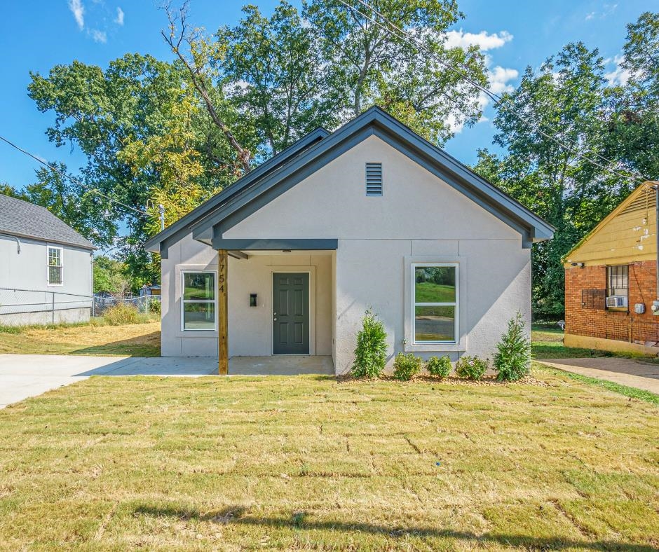 Bungalow-style home featuring a front yard