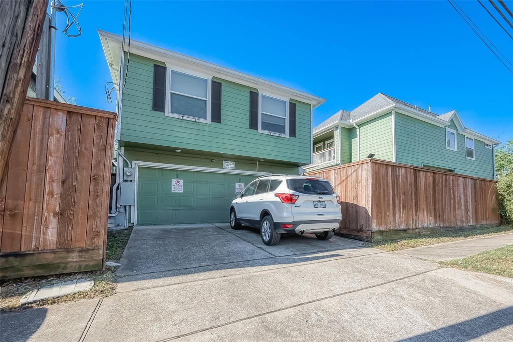 a car parked in front of a house