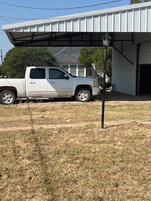 a front view of a house with parking area