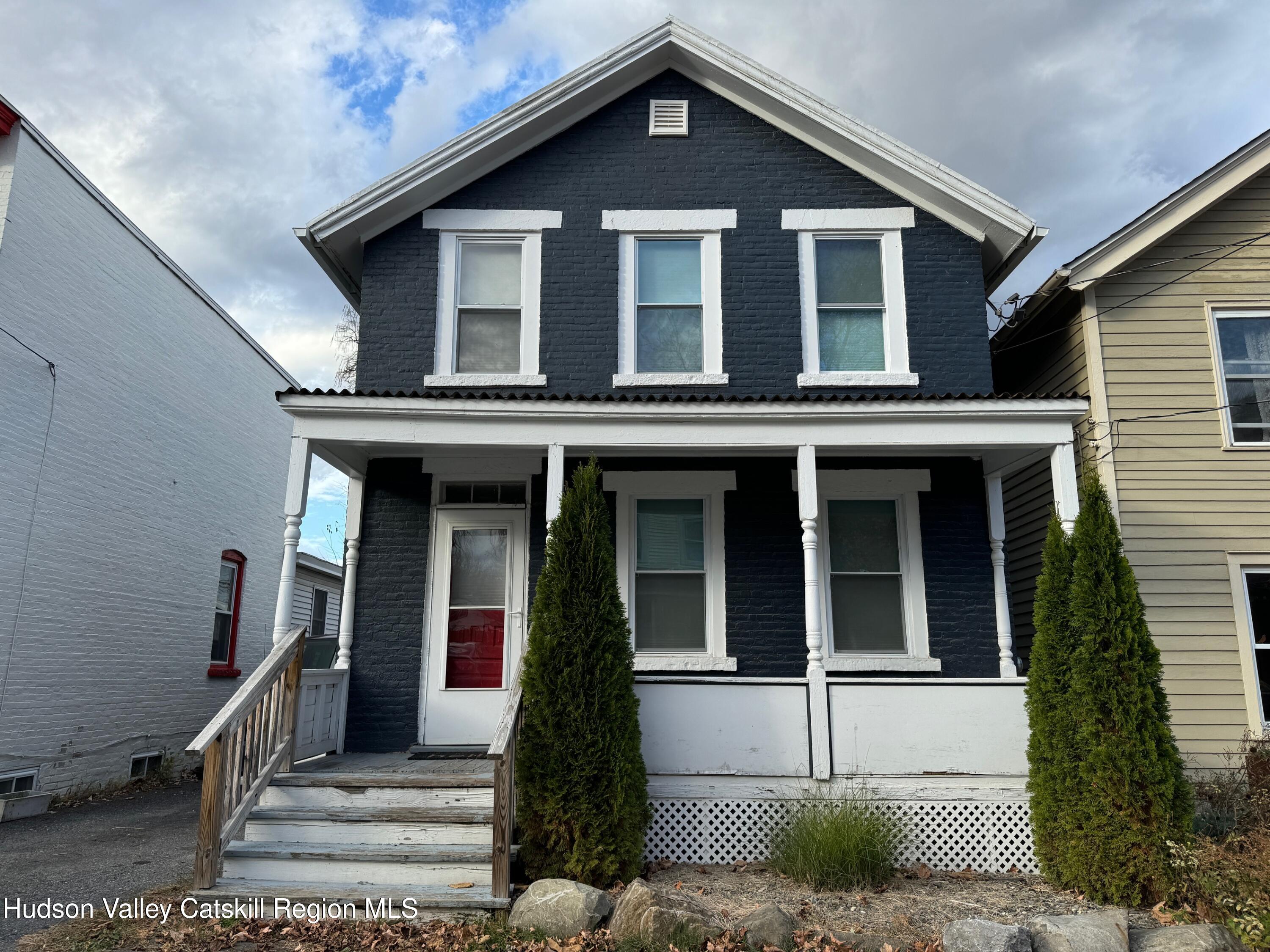 a front view of a house with a porch