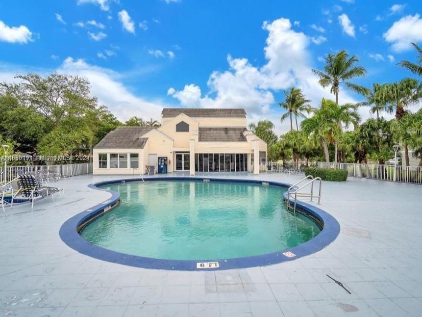 a view of a house with swimming pool