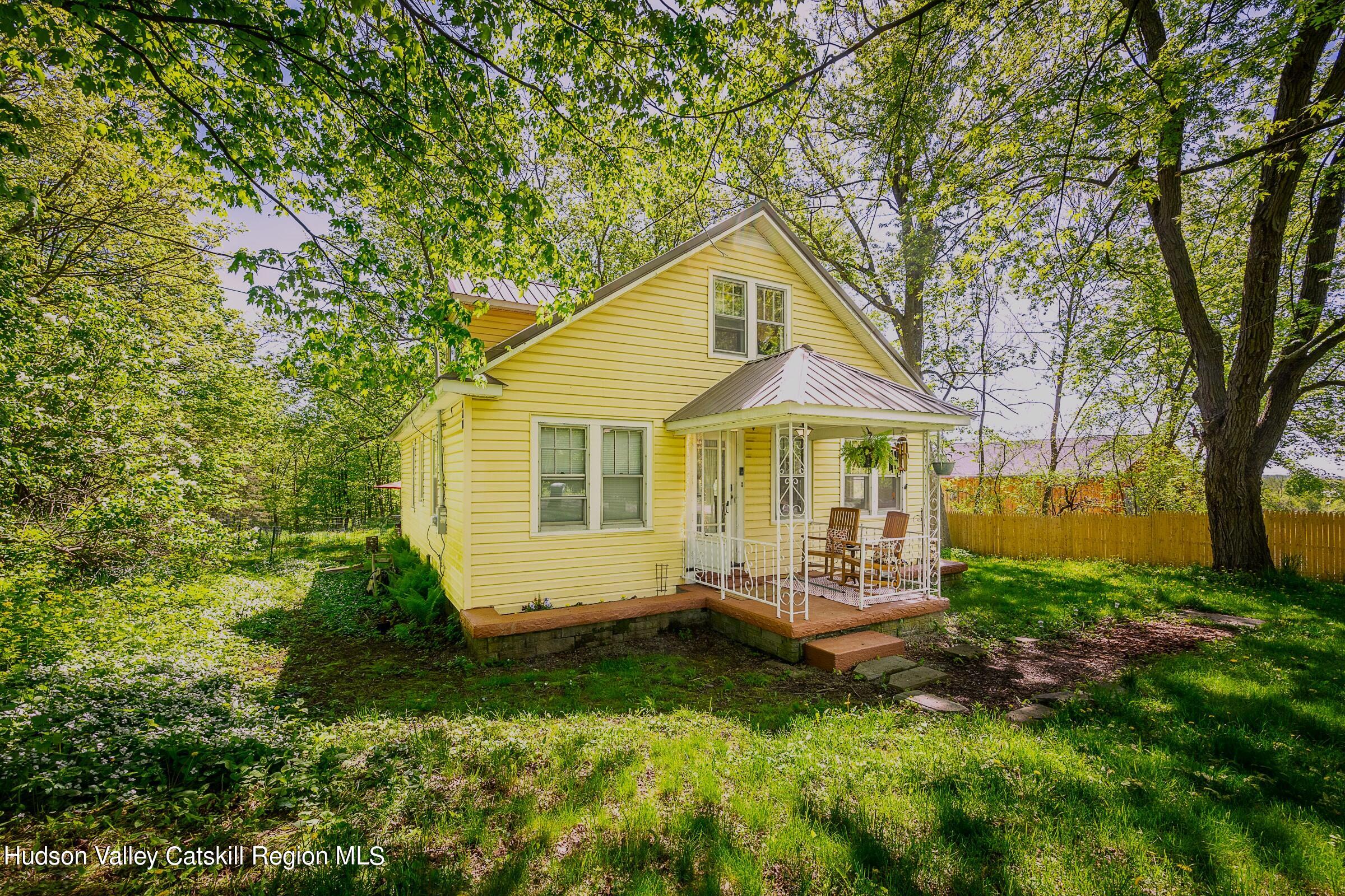 a view of a house with a yard