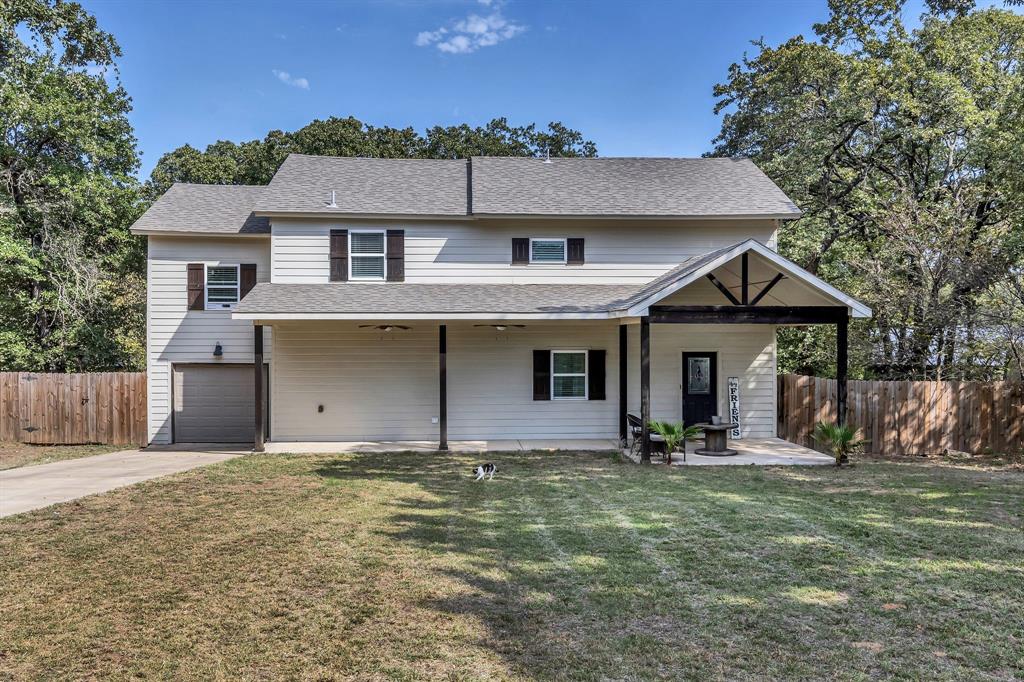 a front view of a house with yard