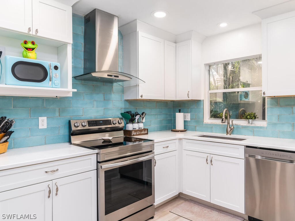 a kitchen with cabinets and window