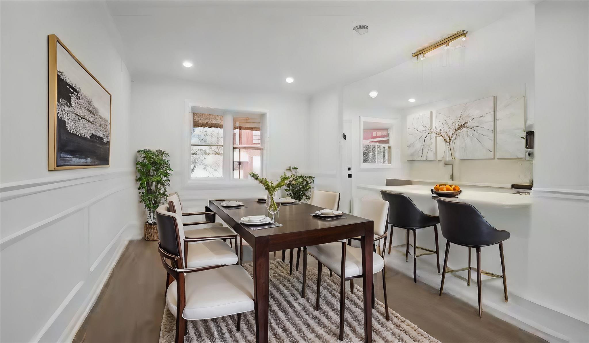 Dining space with wood-type flooring