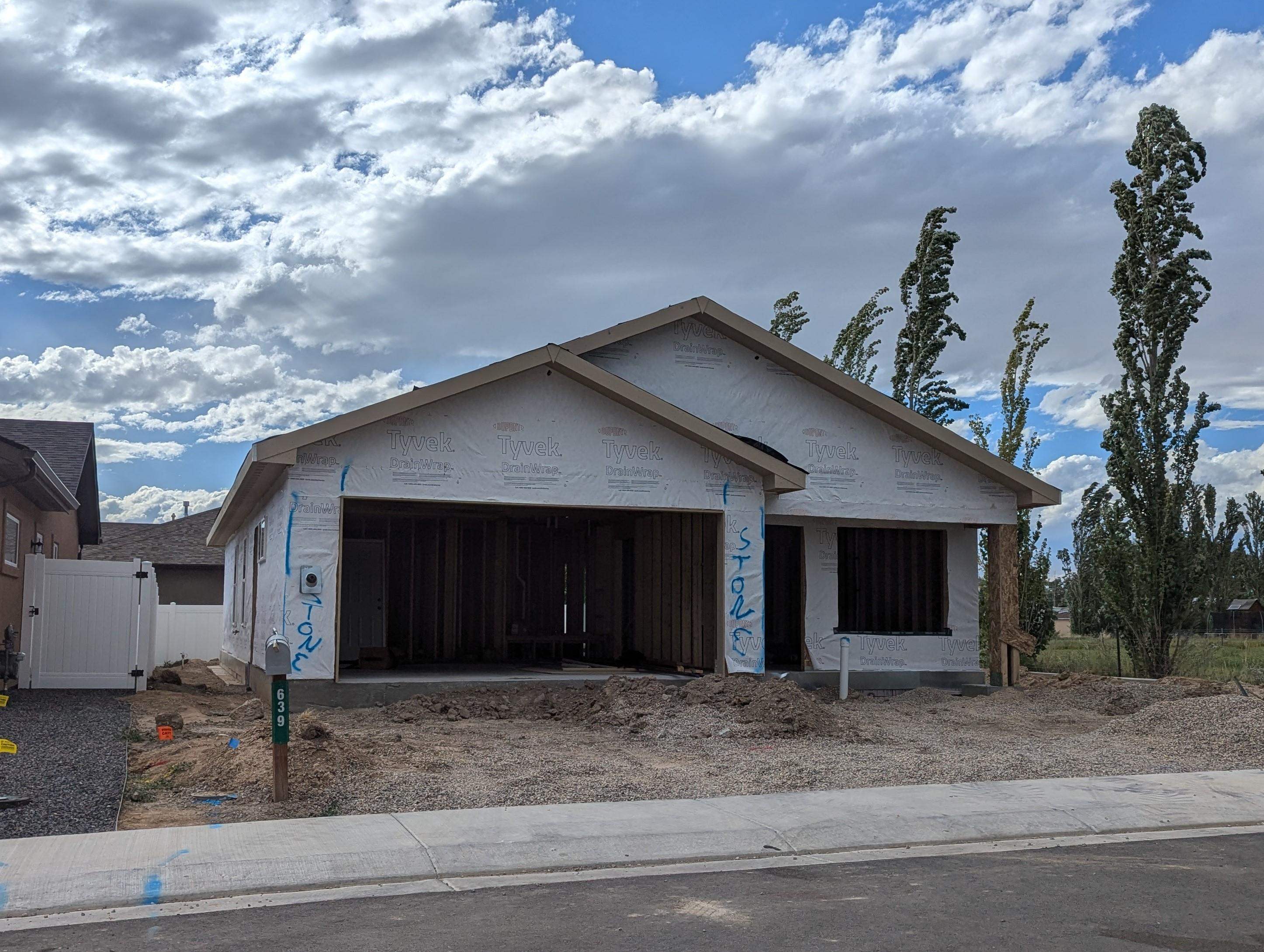 a view of a house with a yard and garage