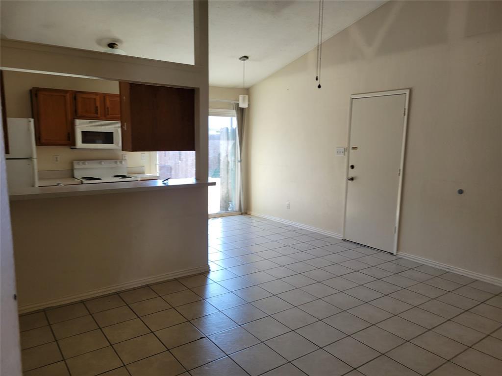 a view of a kitchen cabinets and stainless steel appliances