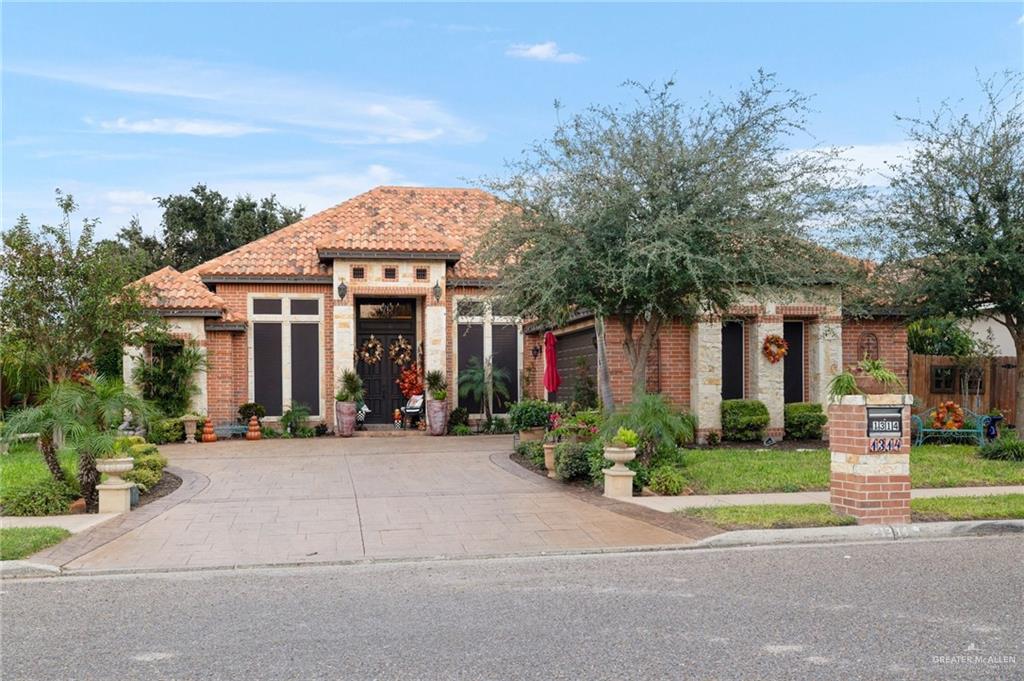 front view of a house with a small yard