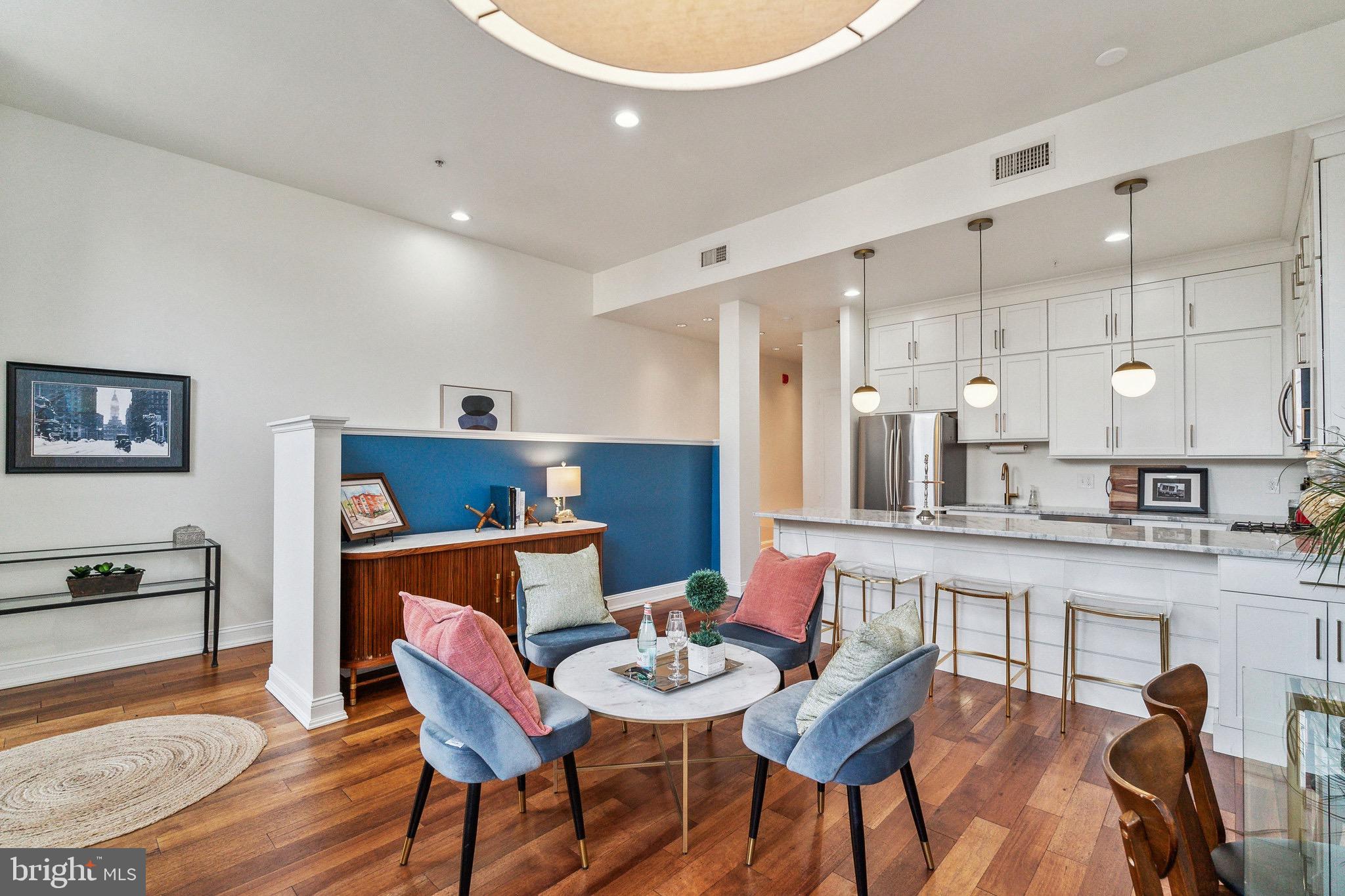 a dining room with furniture and wooden floor