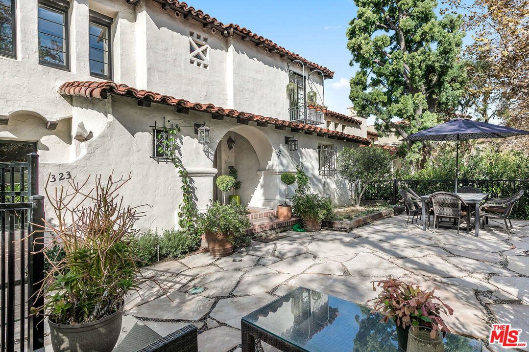 a front view of house with yard and outdoor seating