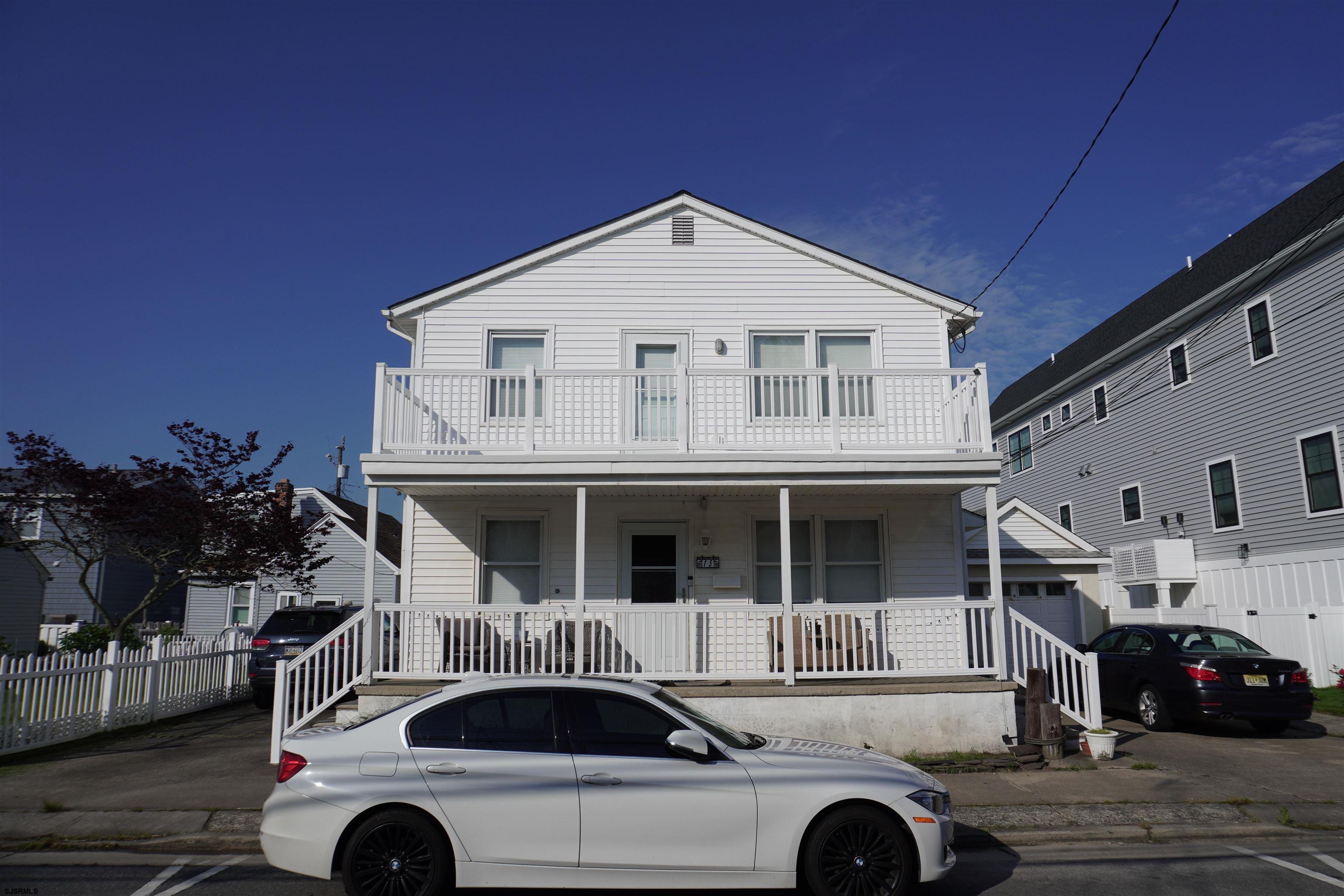 a front view of a house with parking space