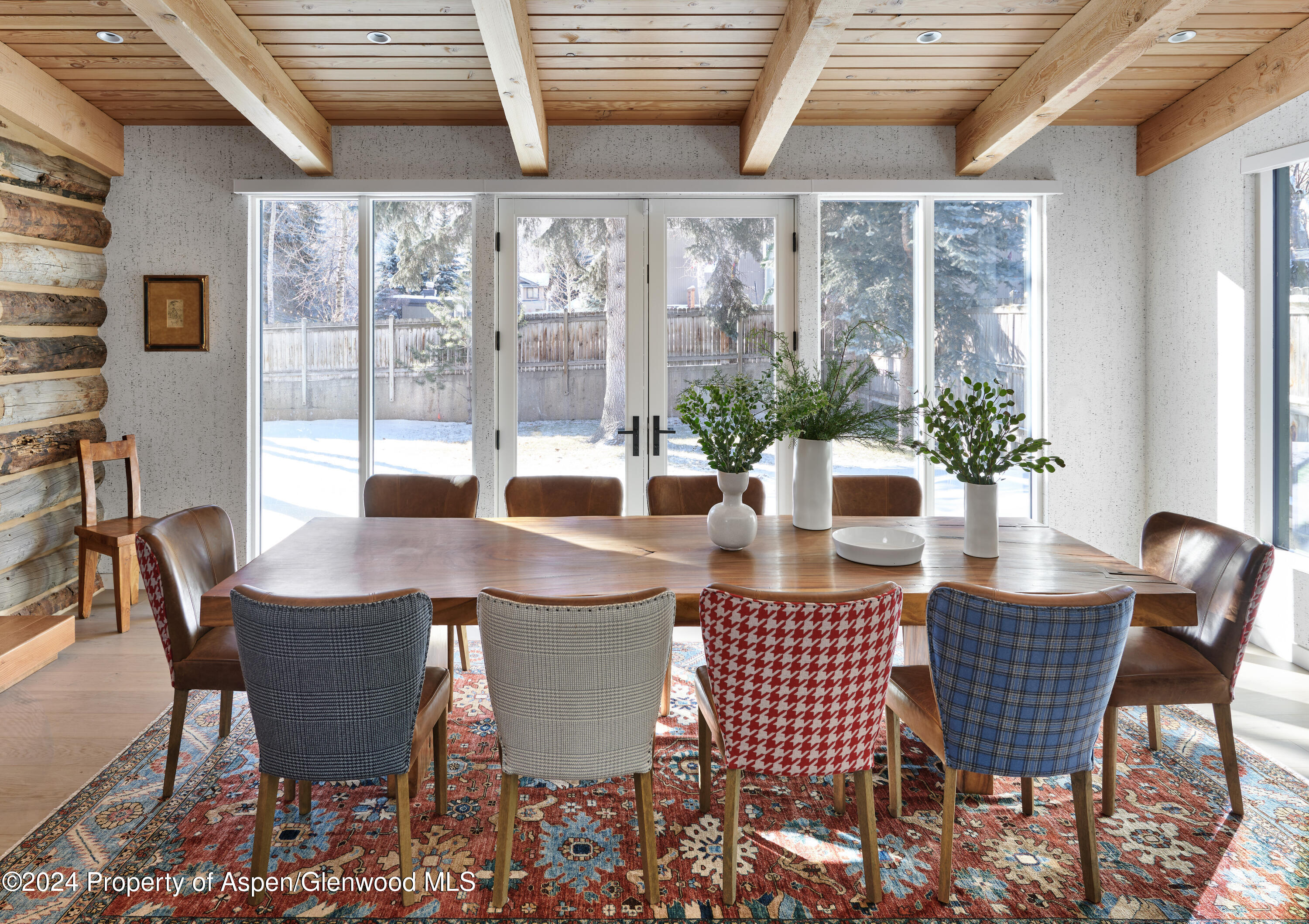 a view of a dining room with furniture wooden floor and glass door