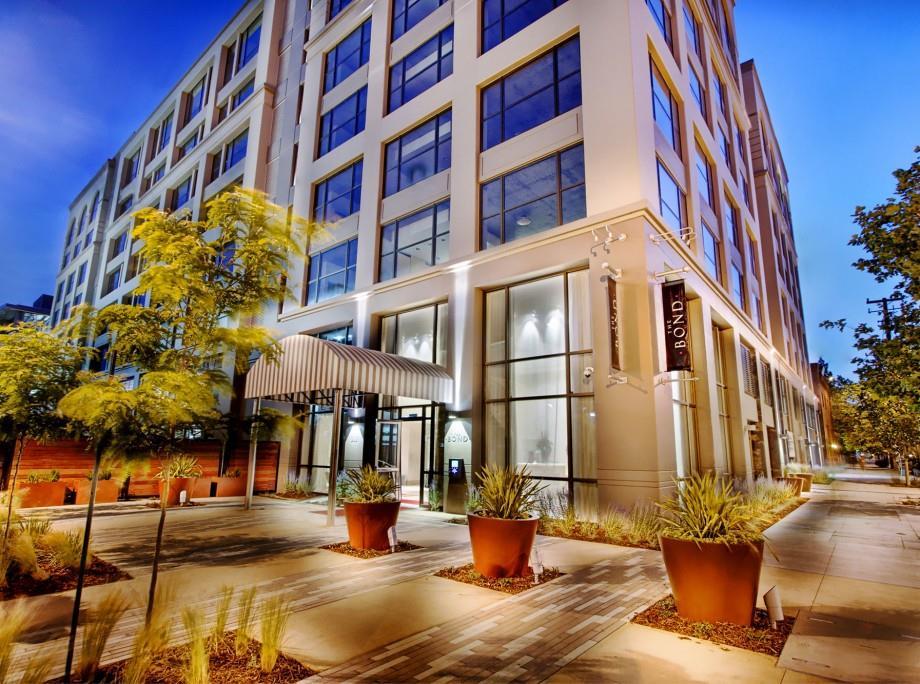 a view of a building with a lot of chairs and a fountain