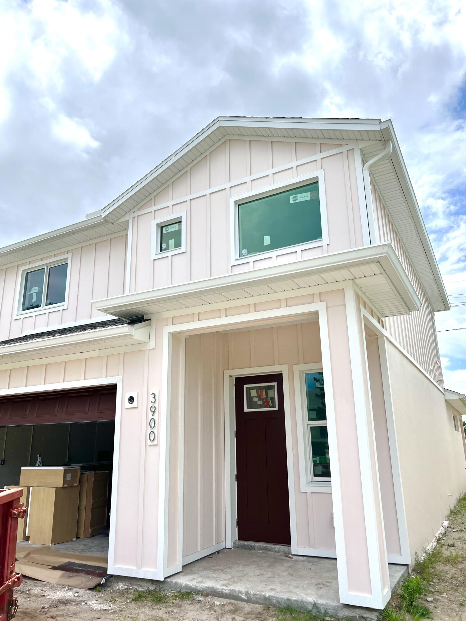 a front view of a house with a garage