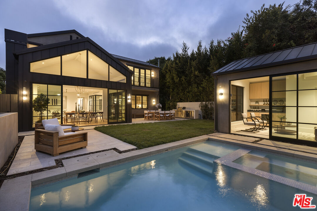 a view of swimming pool with outdoor seating