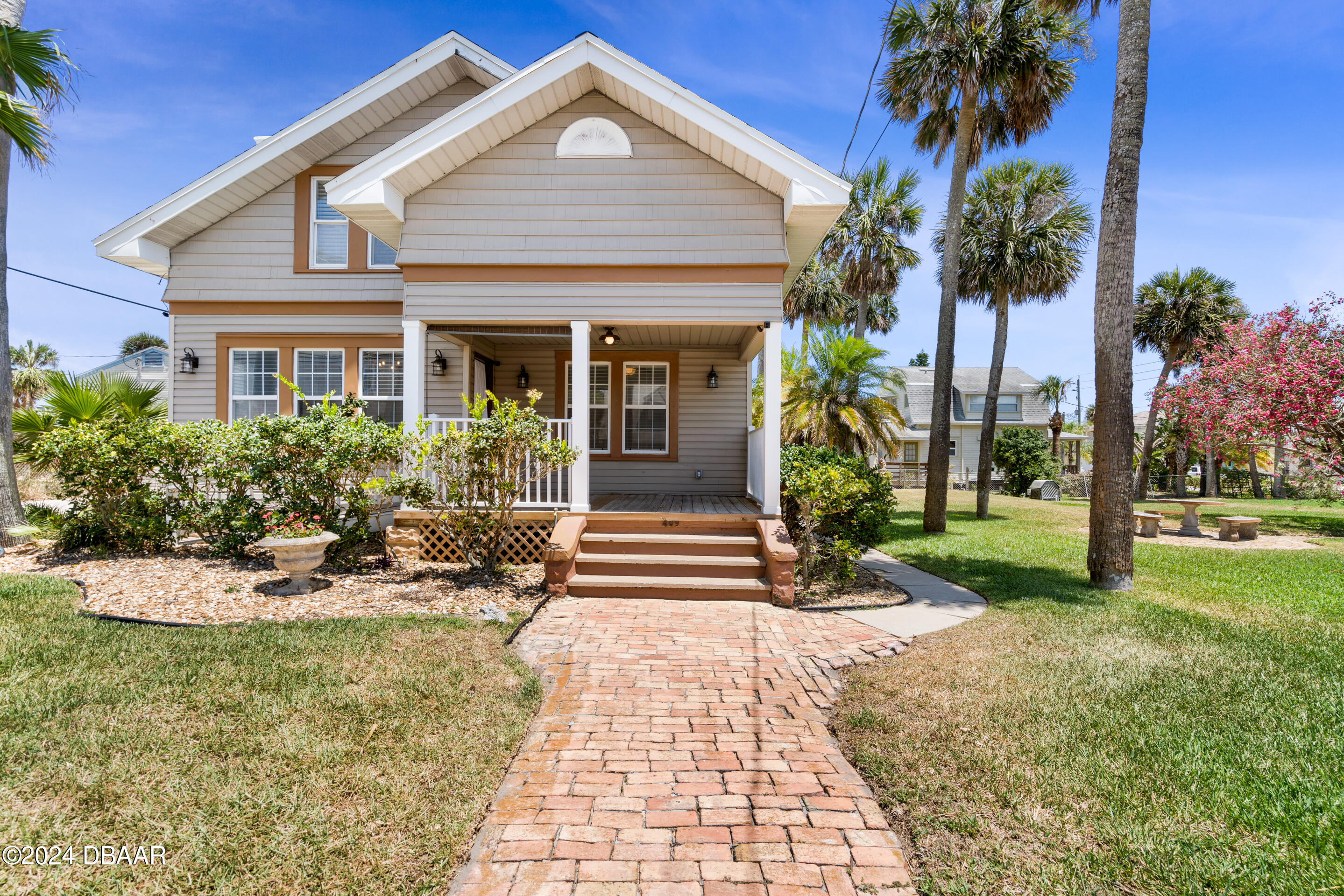 a front view of a house with garden