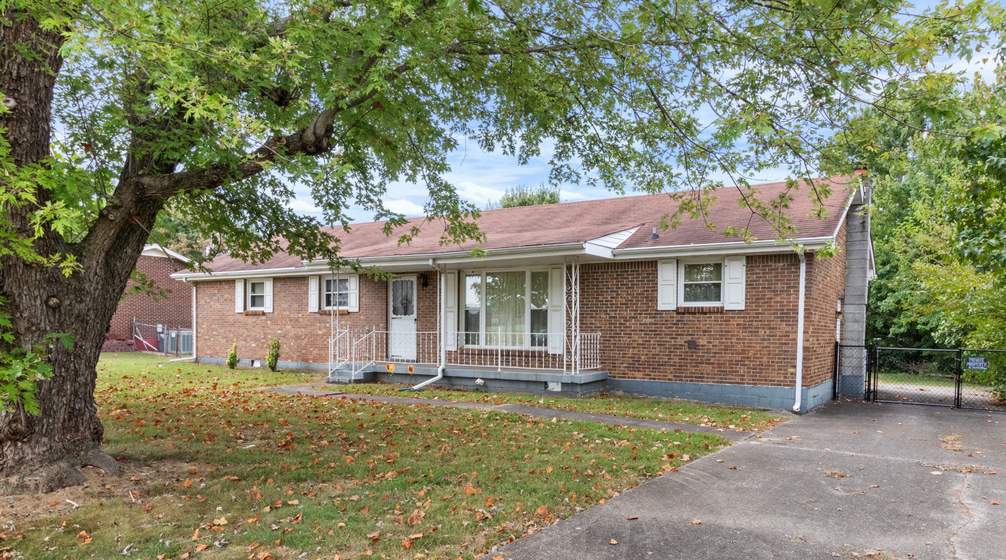 front view of a house with a yard