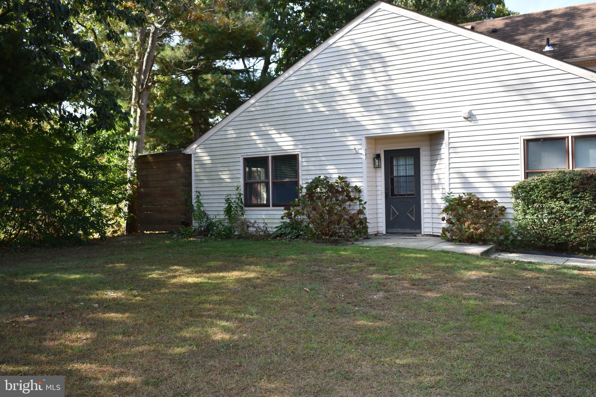 a view of a house with a yard and garage