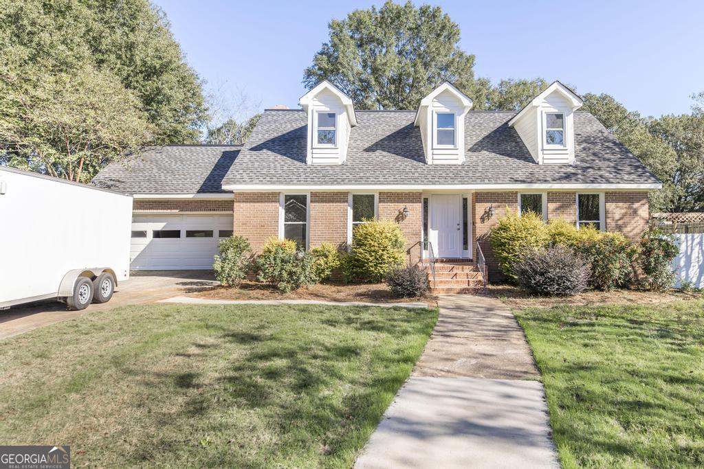 front view of a house with a yard